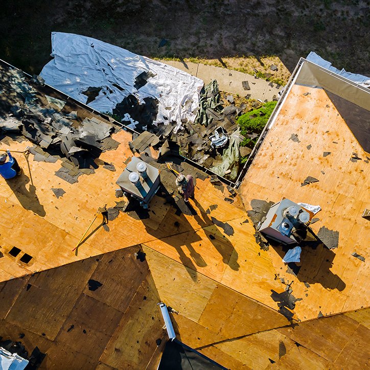 Roofer replace shingle that has been damaged and needing replacement of residential building